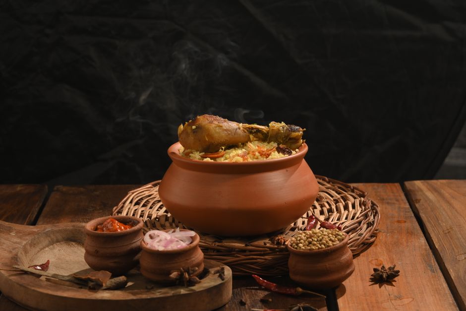 Delicious Kerala chicken biryani served in a traditional clay pot with spices.